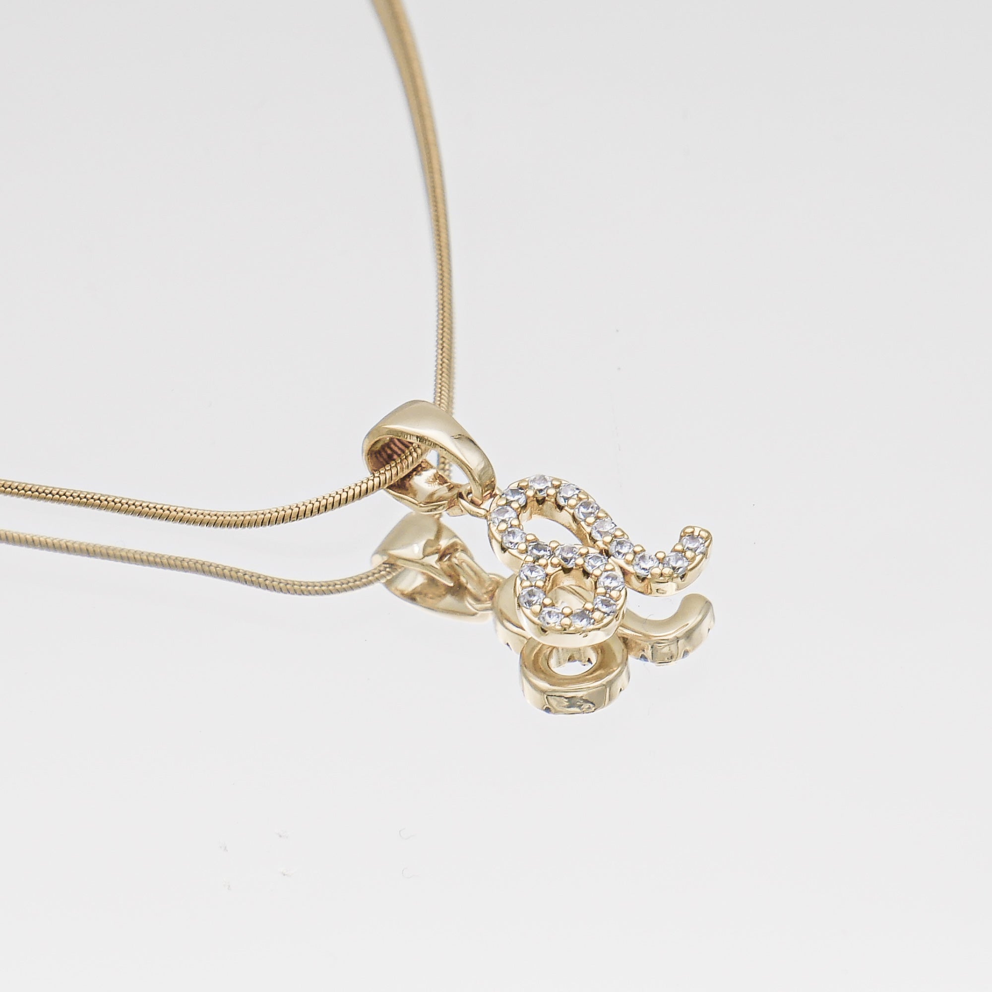 Gold ICY Zodiac Leo Symbol Pendant Necklace by PRYA